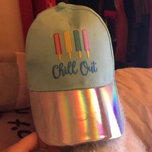 A mint colored cap that says “Chill Out” on it.
